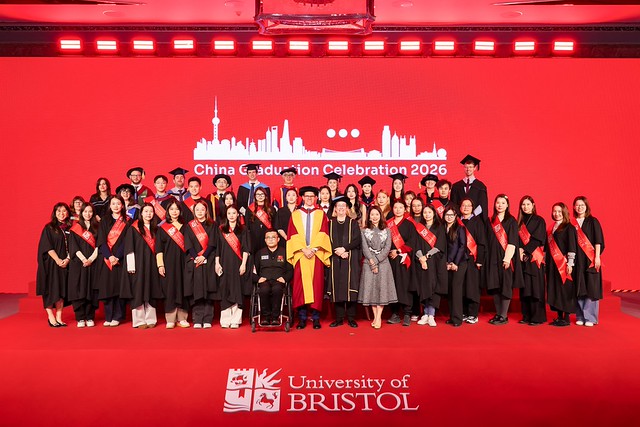 The Graduation delegation and graduates on the stage